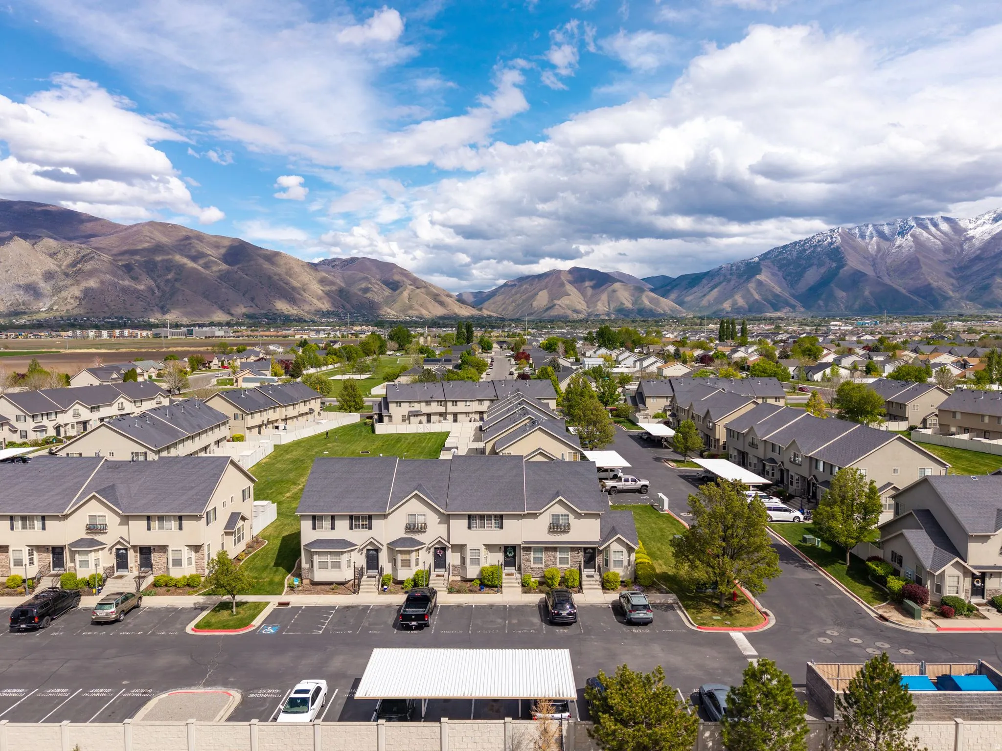 Aerial view of residential area featuring mountains