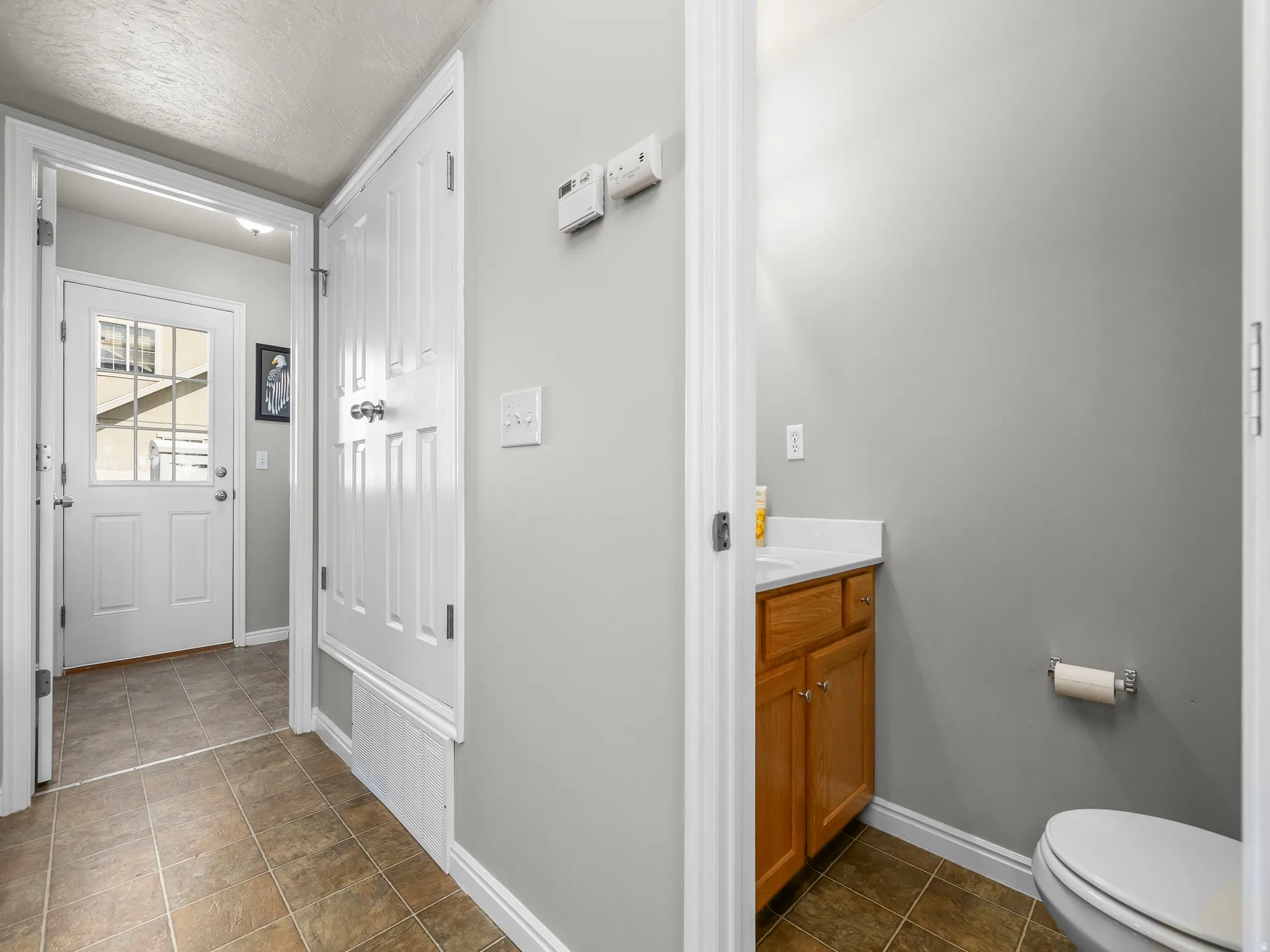 Bathroom with vanity and a textured ceiling