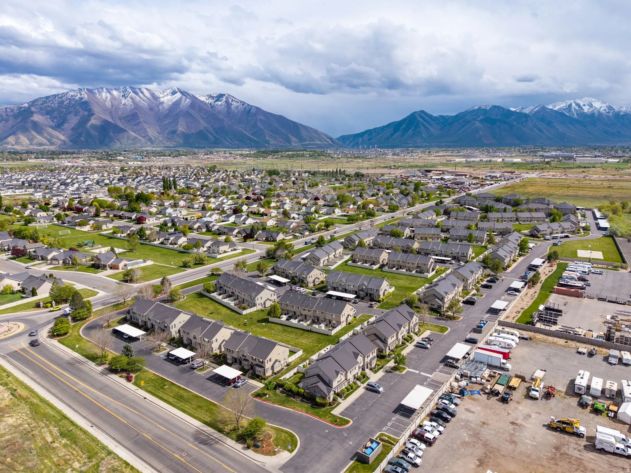Aerial perspective of suburban area featuring a mountain backdrop