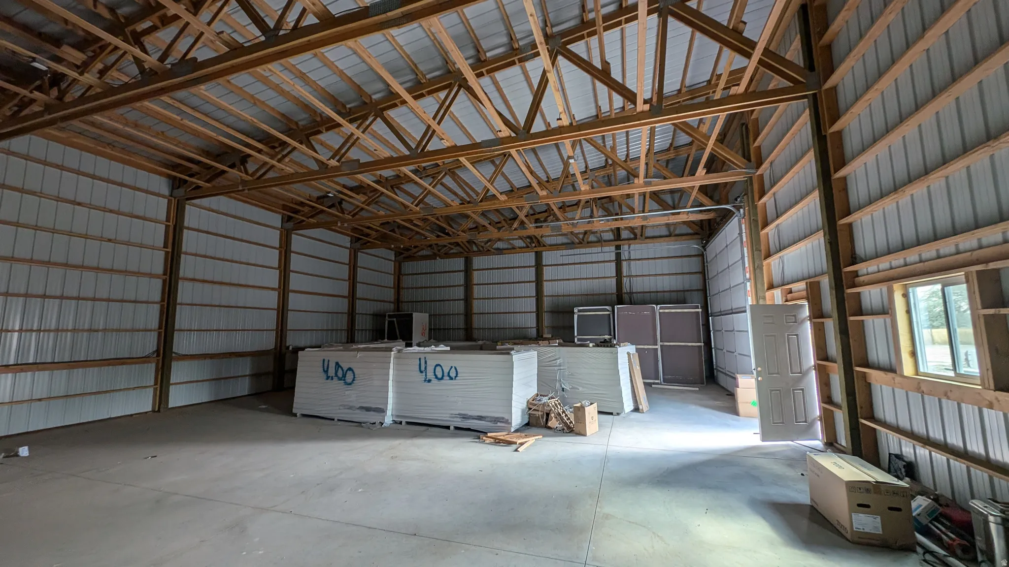 Garage featuring metal wall