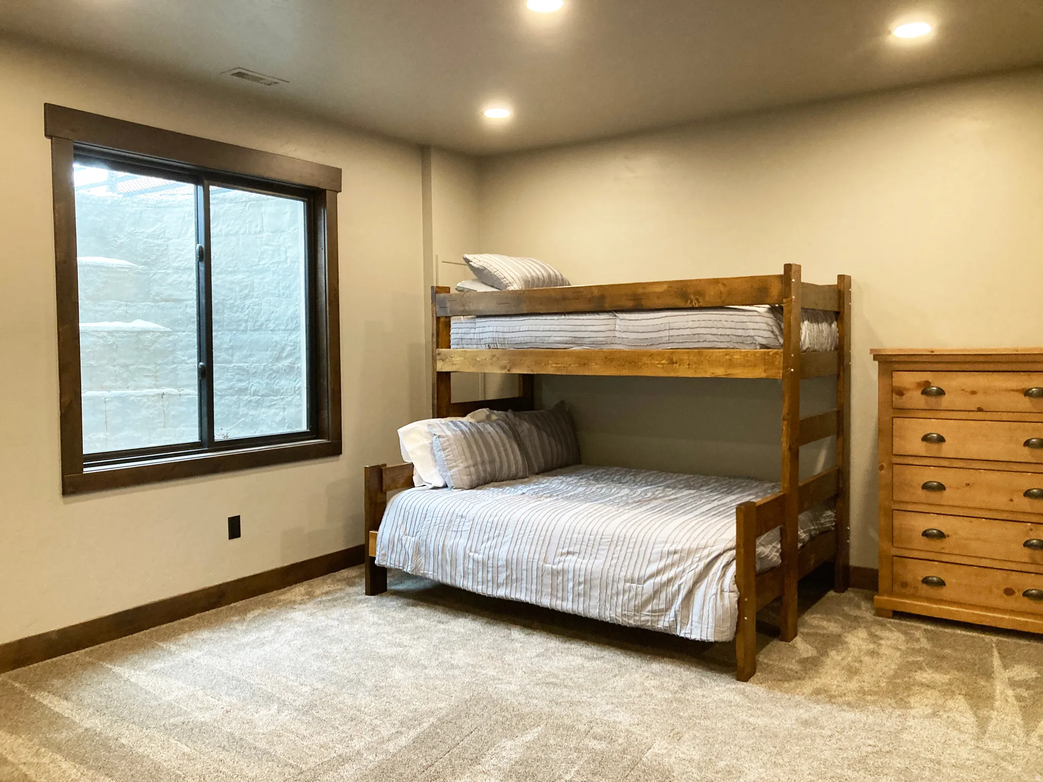 Bedroom with recessed lighting and light carpet