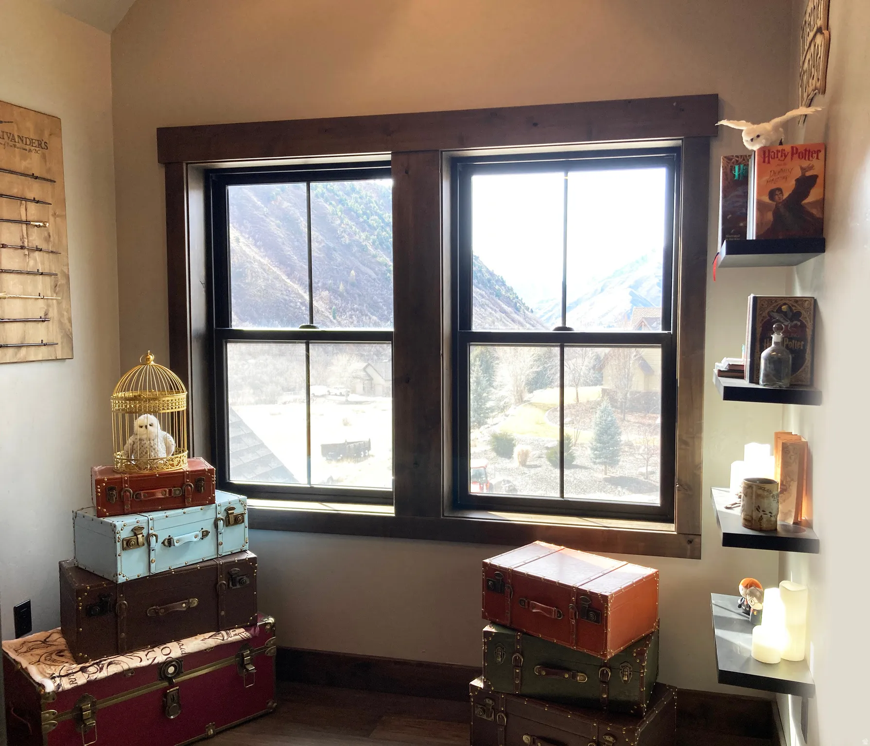 Bedroom with dark wood finished floors and baseboards