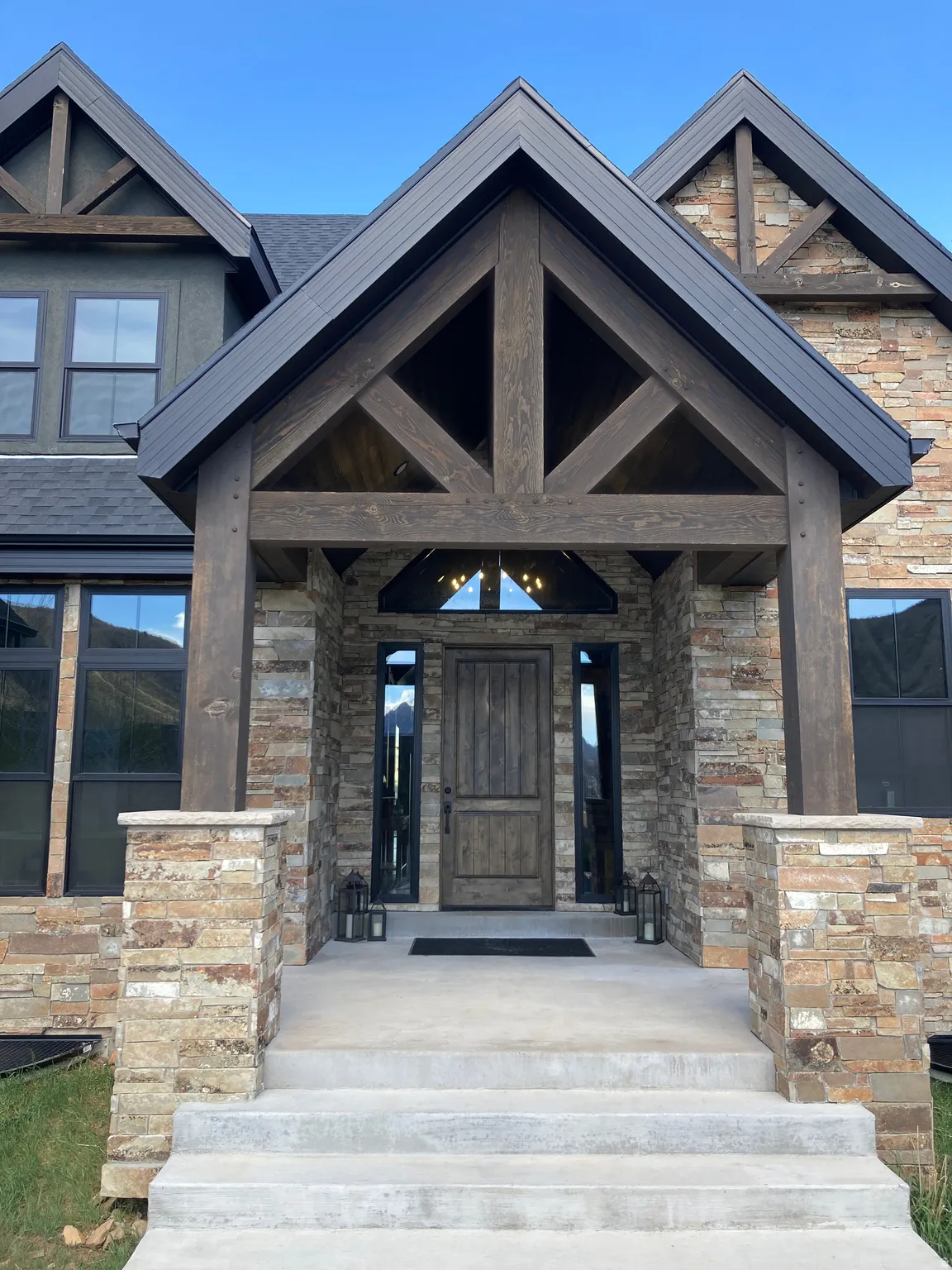 Property entrance featuring stone siding