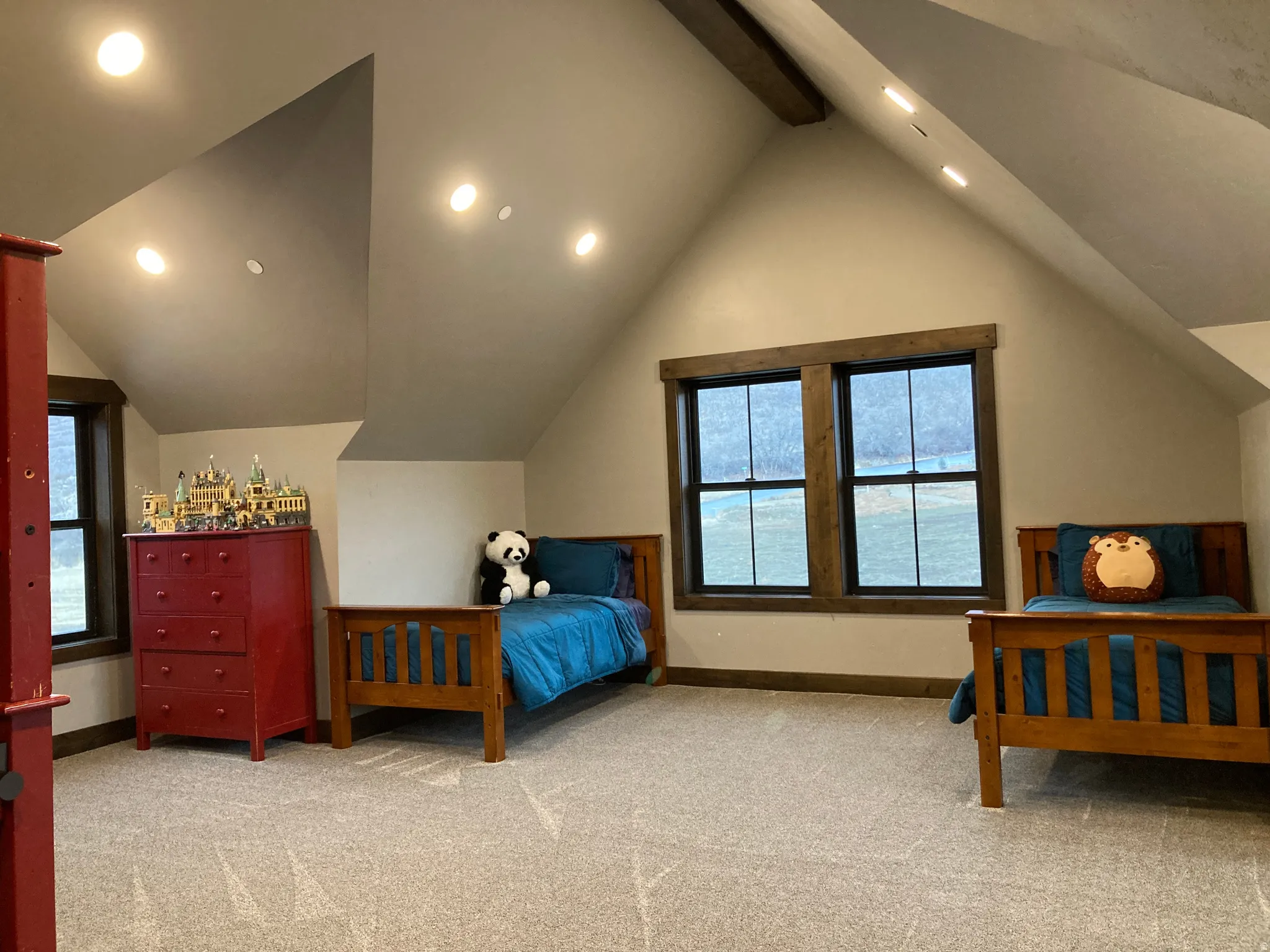 Bedroom with recessed lighting, light carpet, and beam ceiling