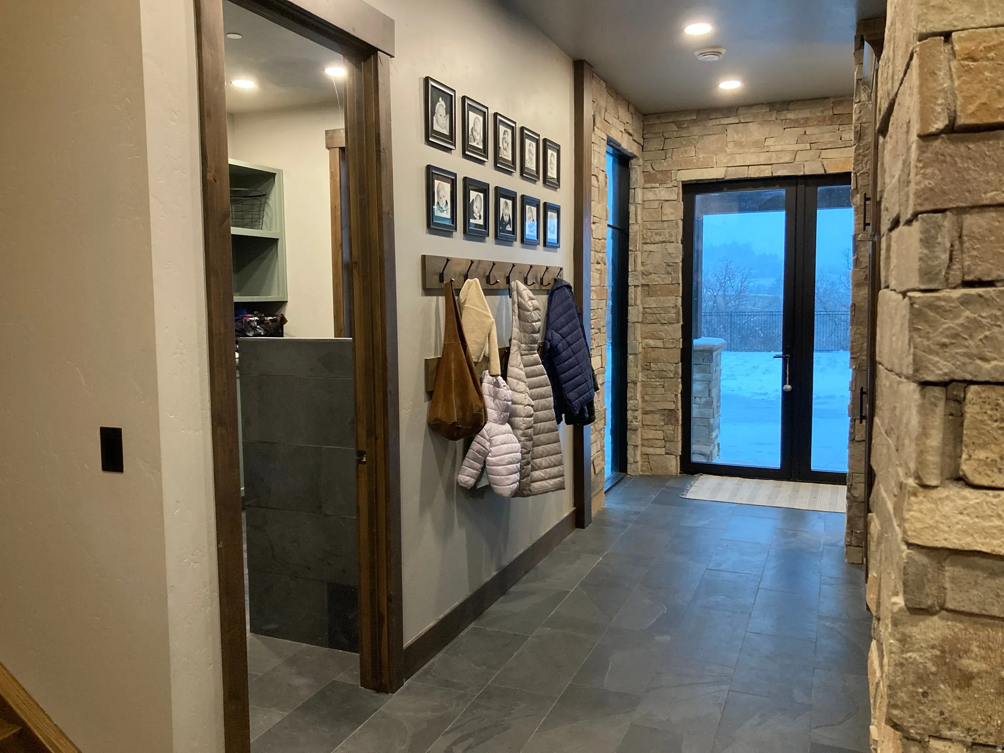 Corridor featuring baseboards and recessed lighting