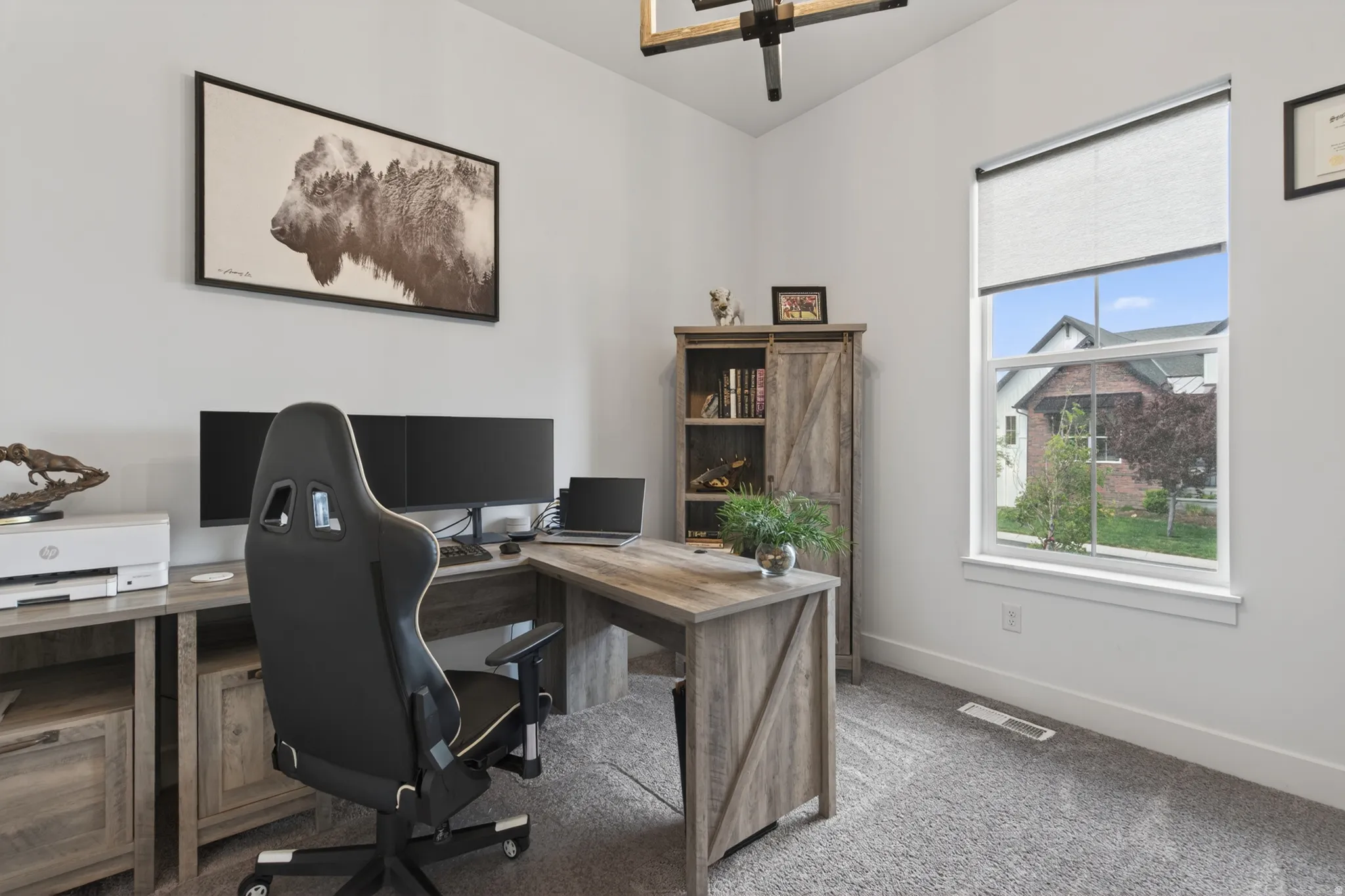 Carpeted office with baseboards