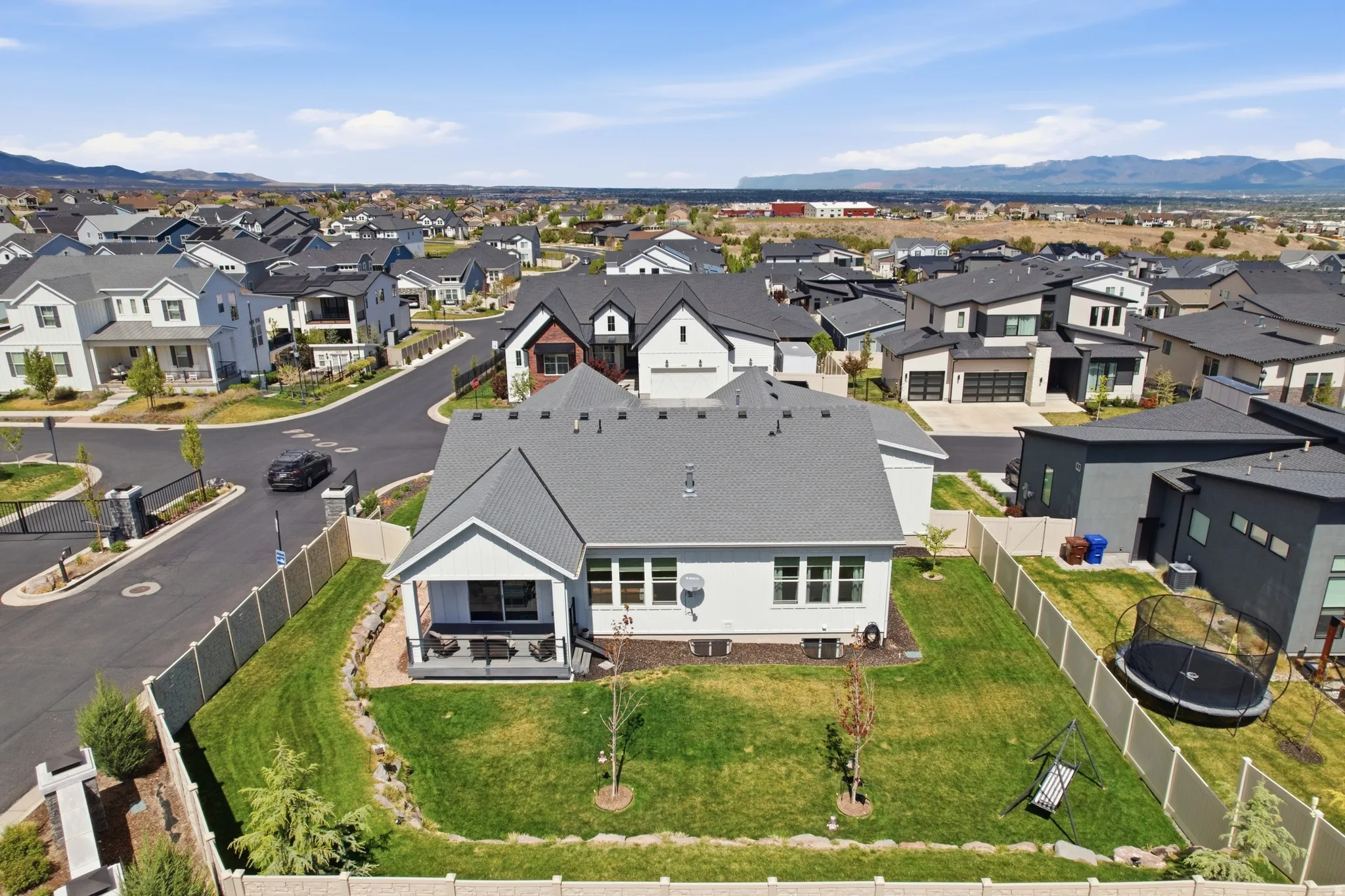 Aerial view of residential area featuring mountains