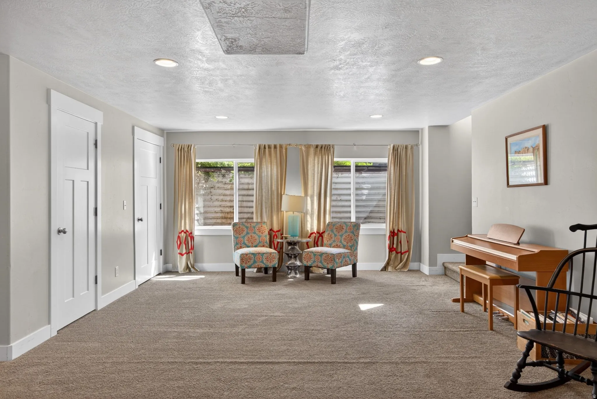 Sitting room with recessed lighting and a textured ceiling