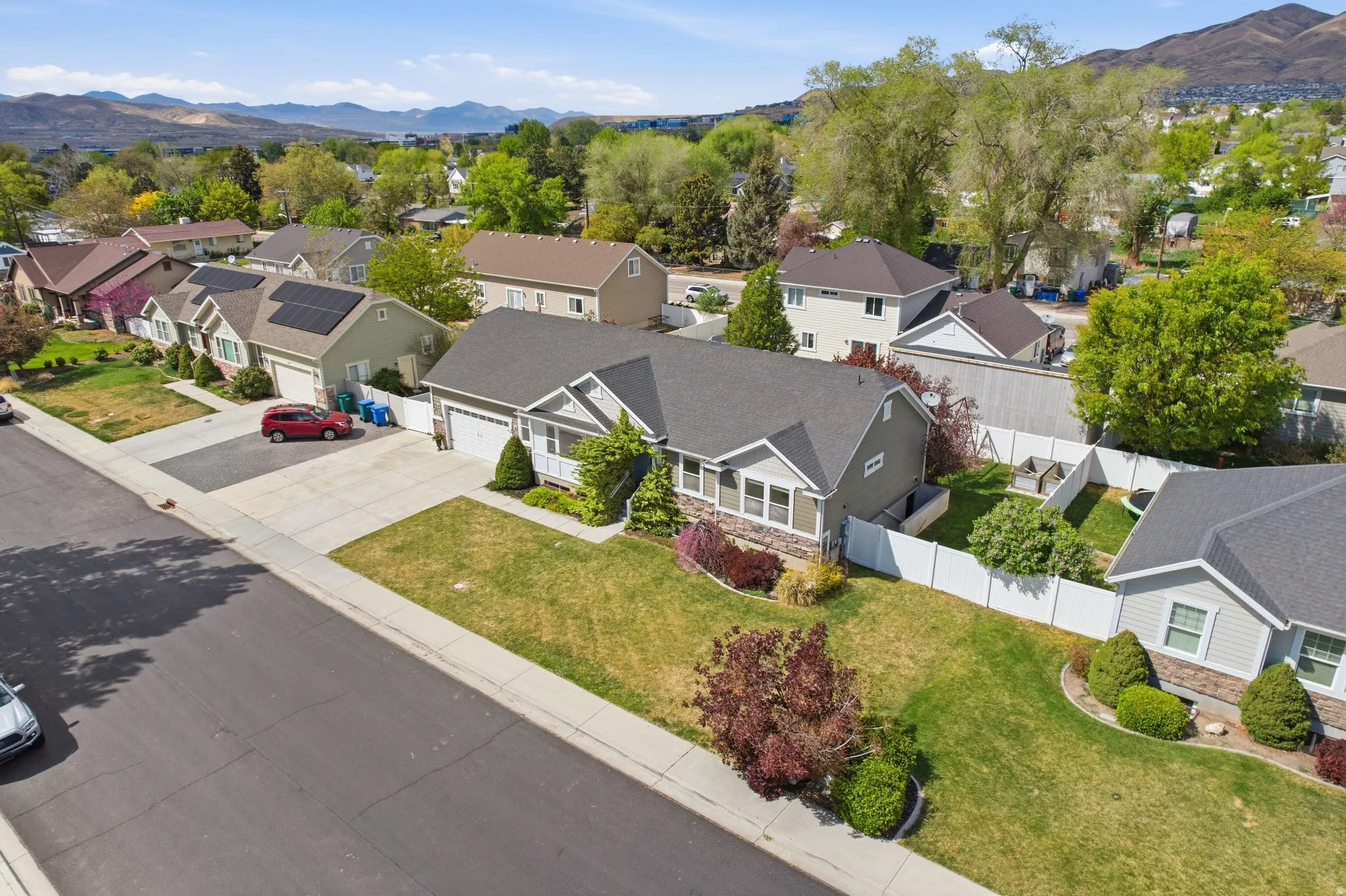 Aerial view of residential area featuring a mountainous background