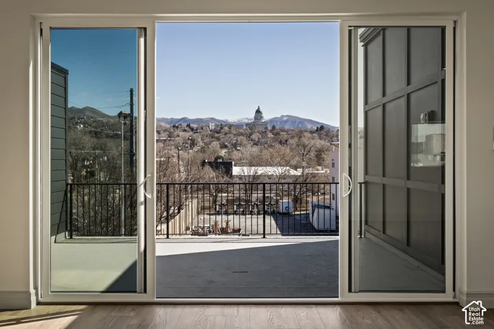 Doorway featuring a mountain view and wood finished floors
