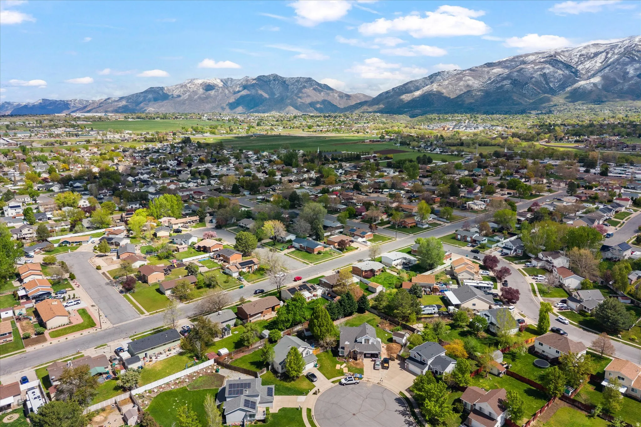 Aerial view of residential area featuring mountains
