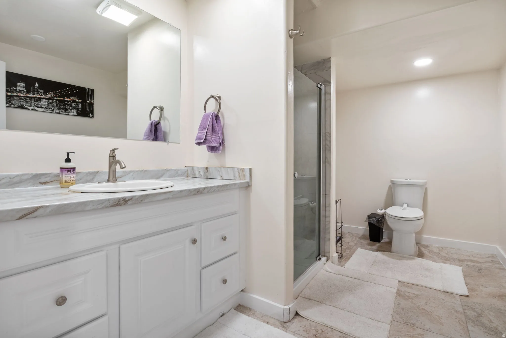 Full bath with vanity, a stall shower, and recessed lighting