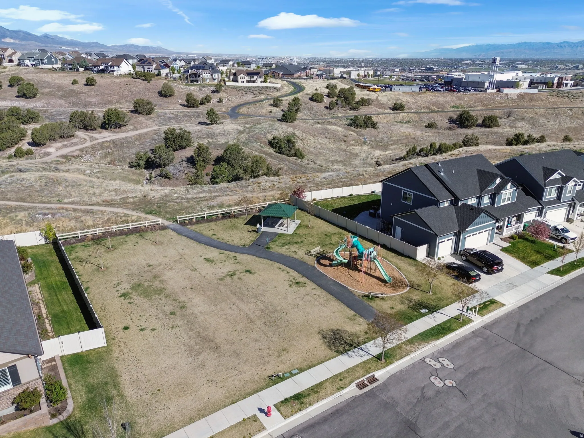Aerial view of residential area featuring mountains