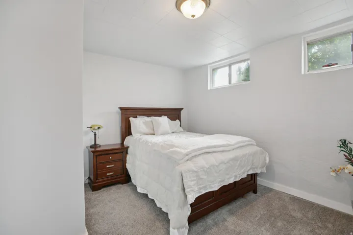 Carpeted bedroom with baseboards