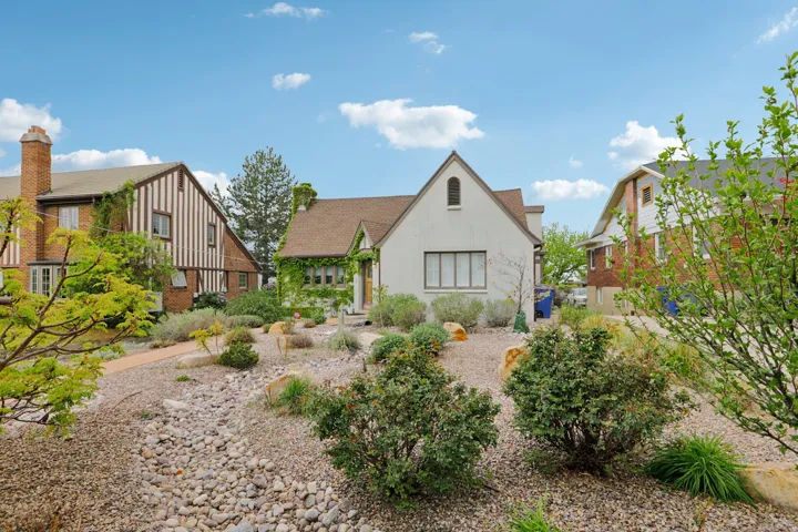 Back of house featuring stucco siding