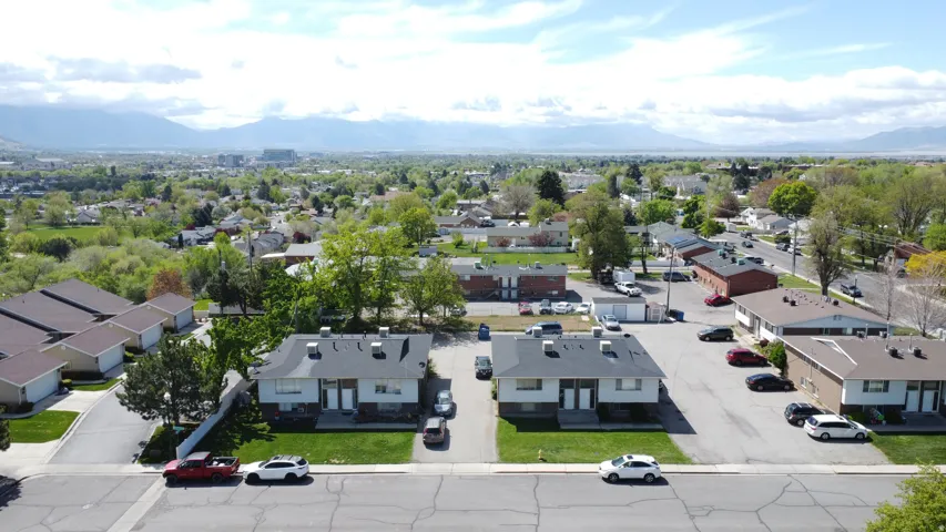 Aerial view of residential area featuring a mountainous background
