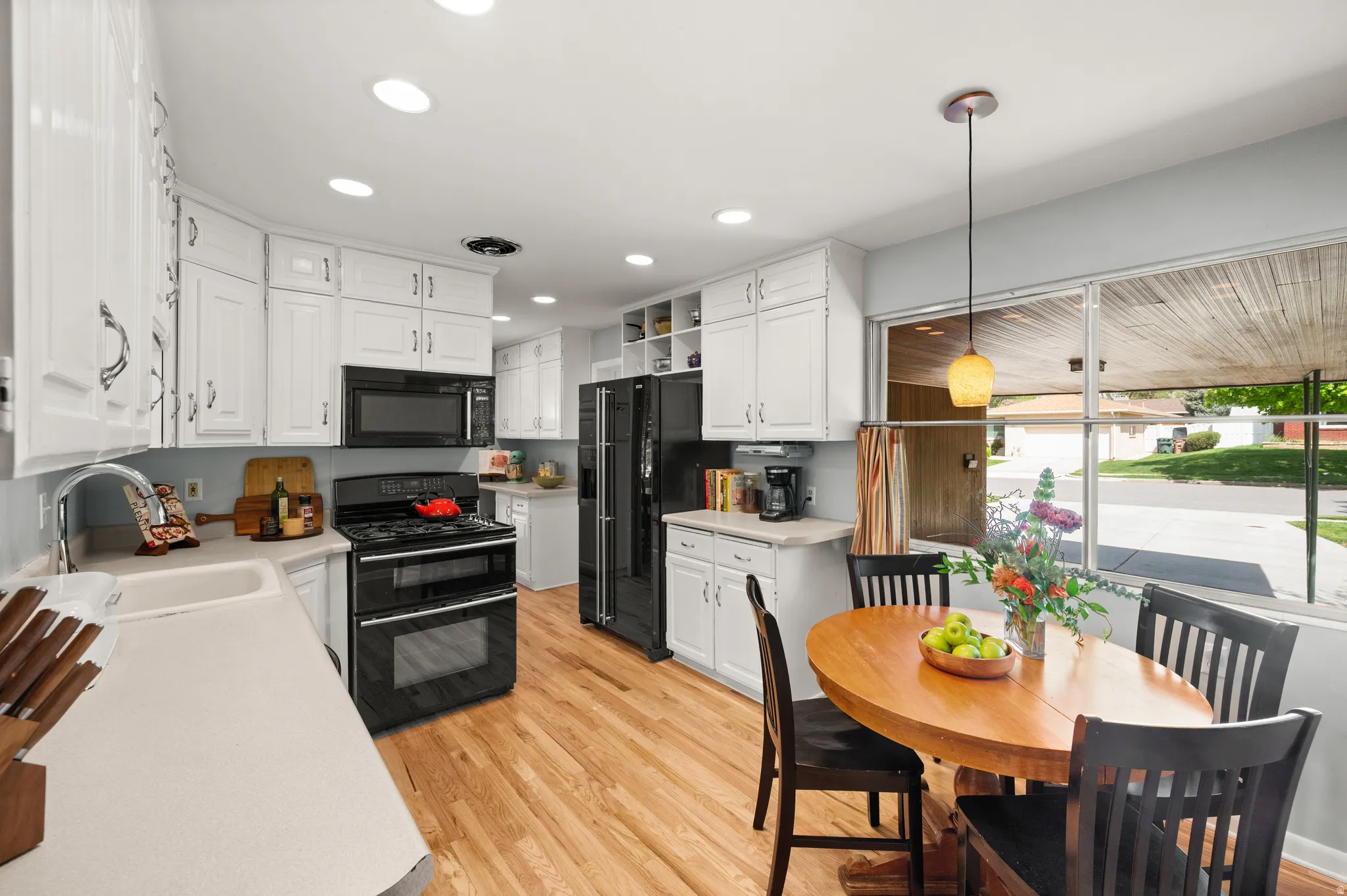 Nice bright kitchen with classic to-the-ceiling cabinets
