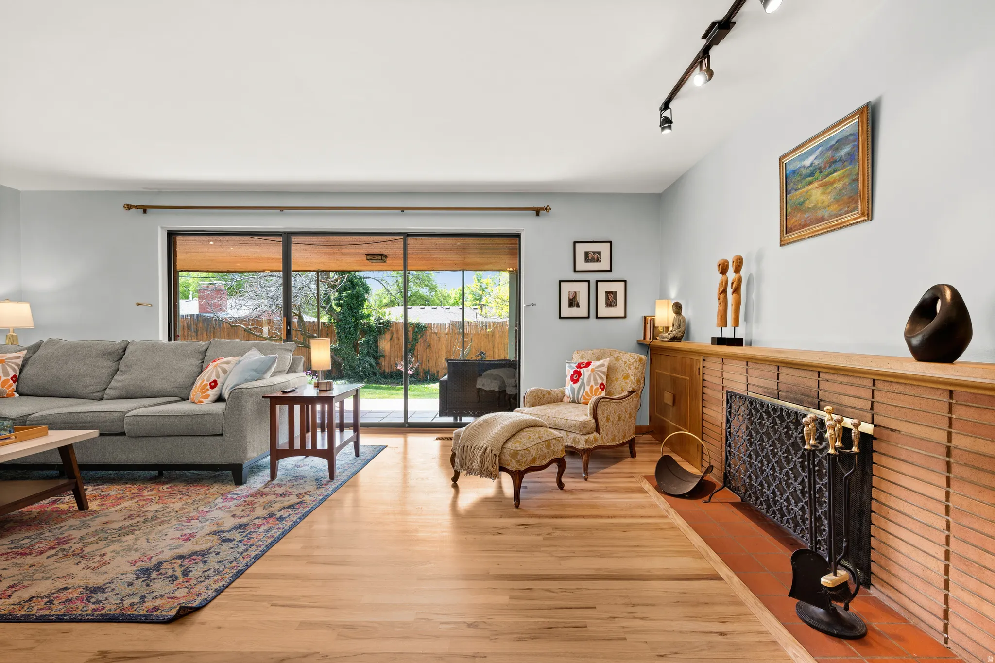 Classic mid-century fireplace, beautiful refinished hardwood floors