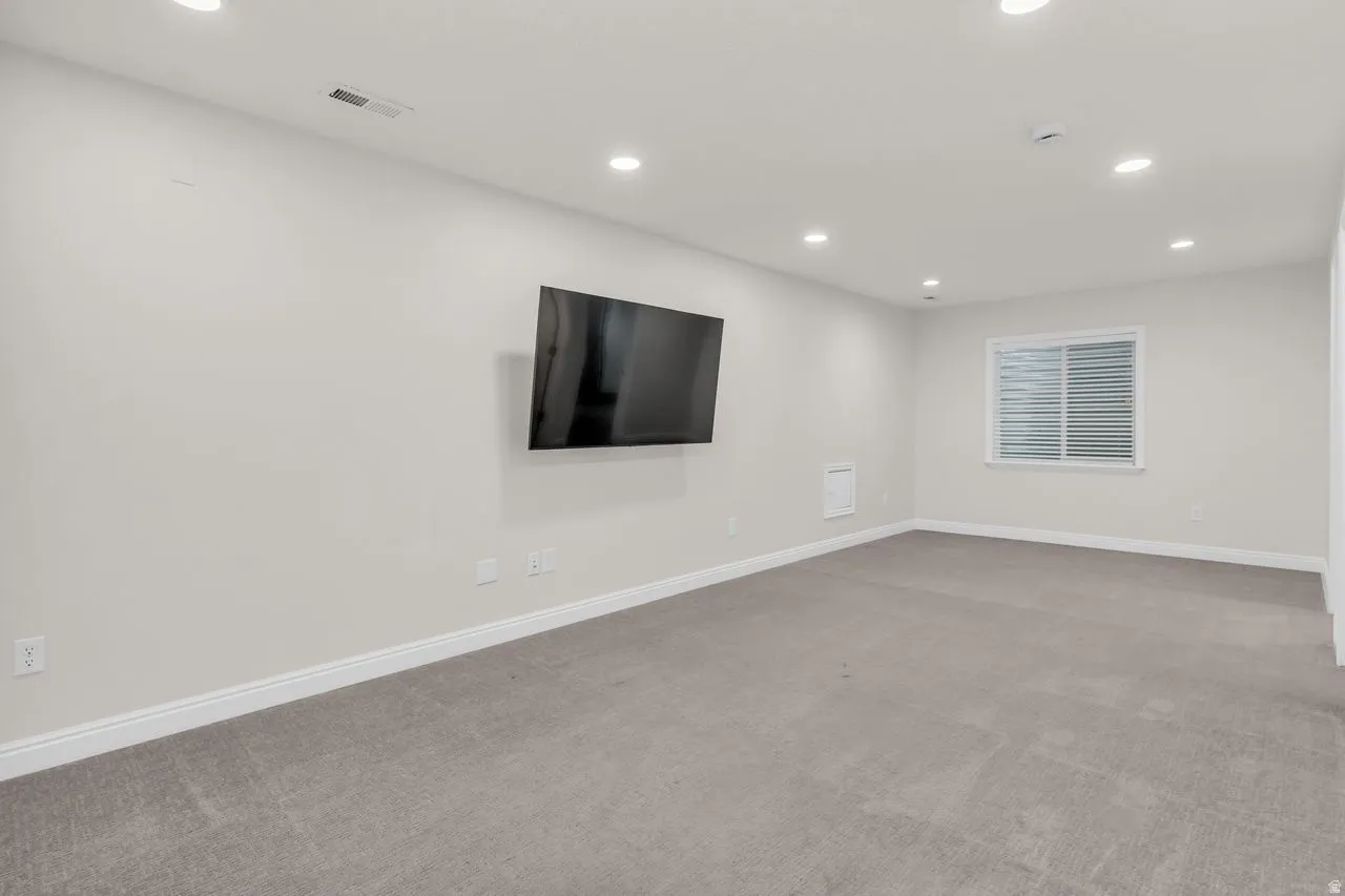 Fully finished basement featuring recessed lighting and large family room