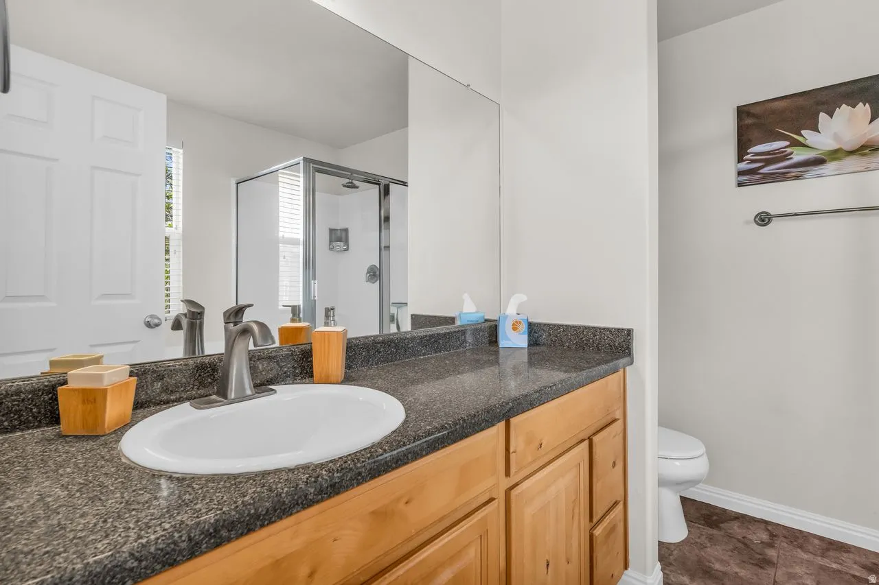 Full primary bath with a stall shower and large vanity