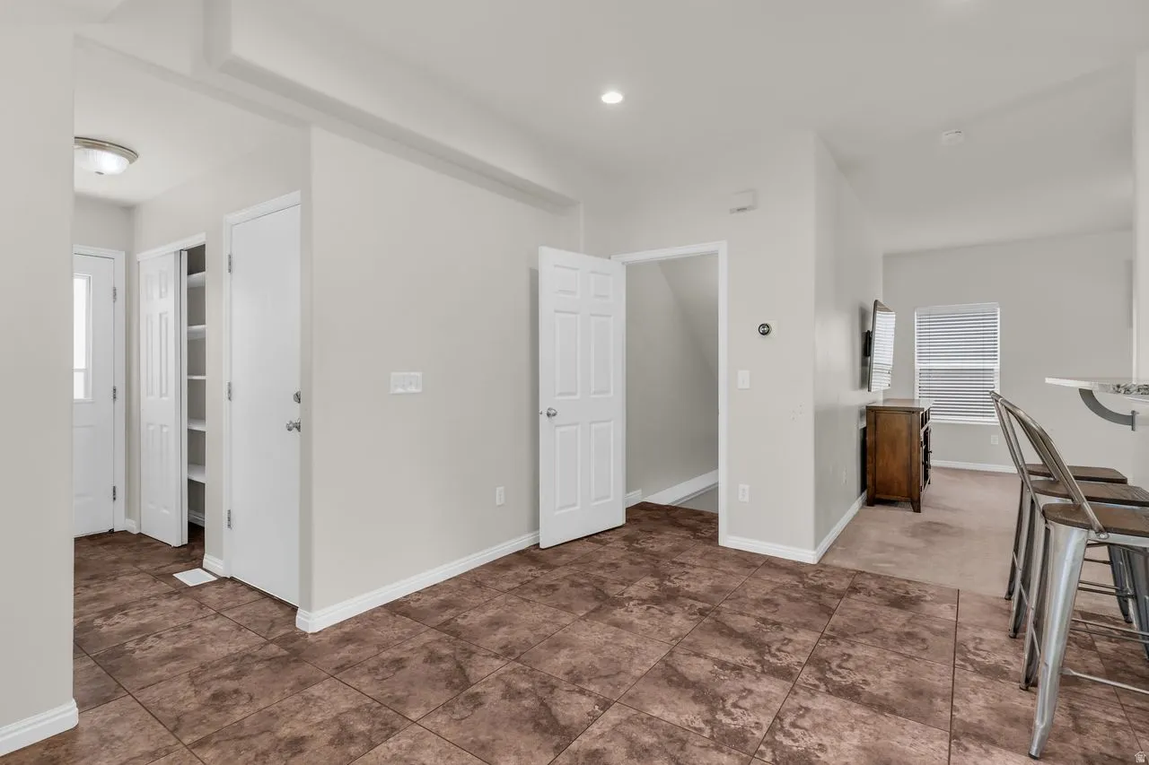 Open concept dining area with recessed lighting