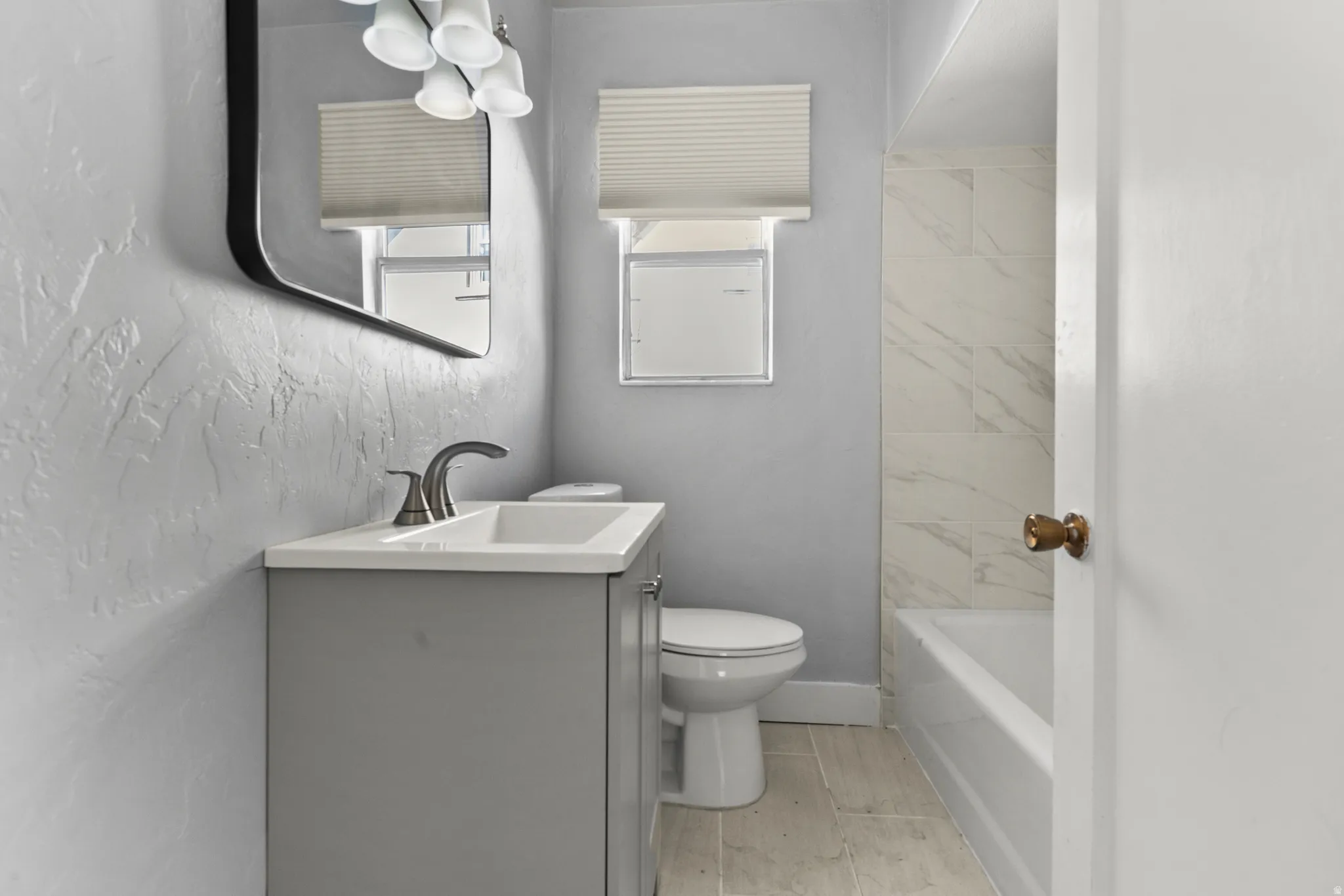 Bathroom with vanity and wood finish floors