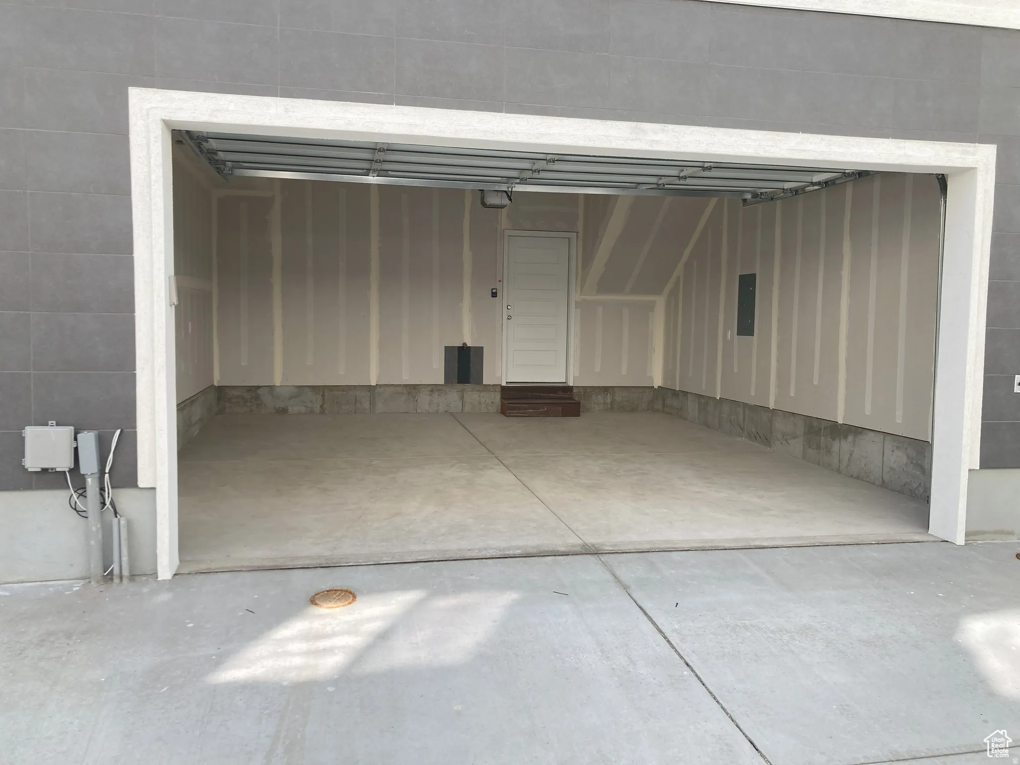 Garage featuring electric panel