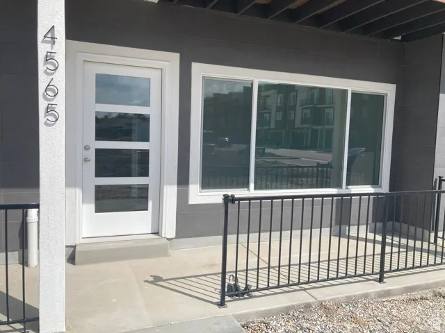 Property entrance with a patio area