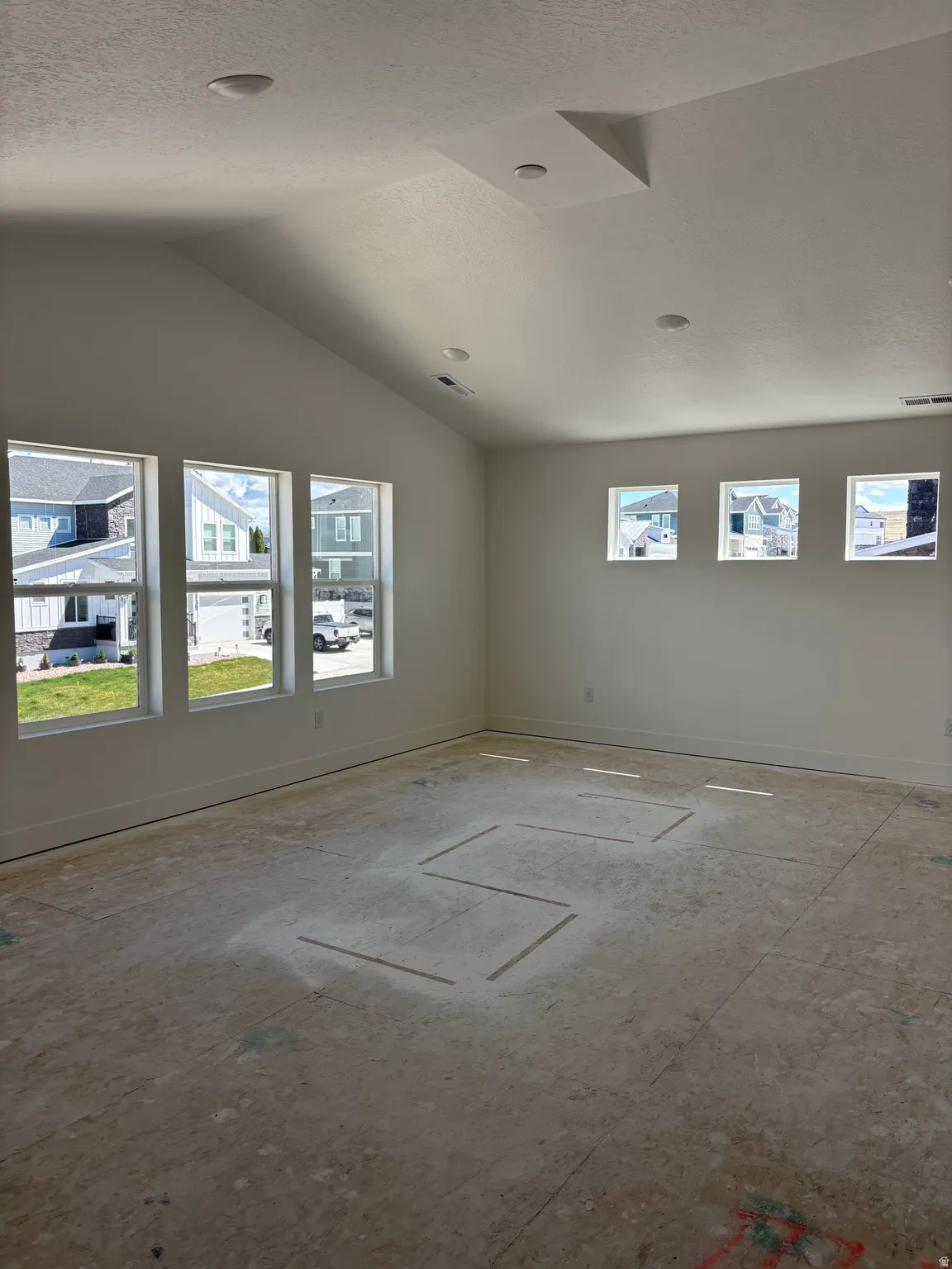 Spare room featuring baseboards