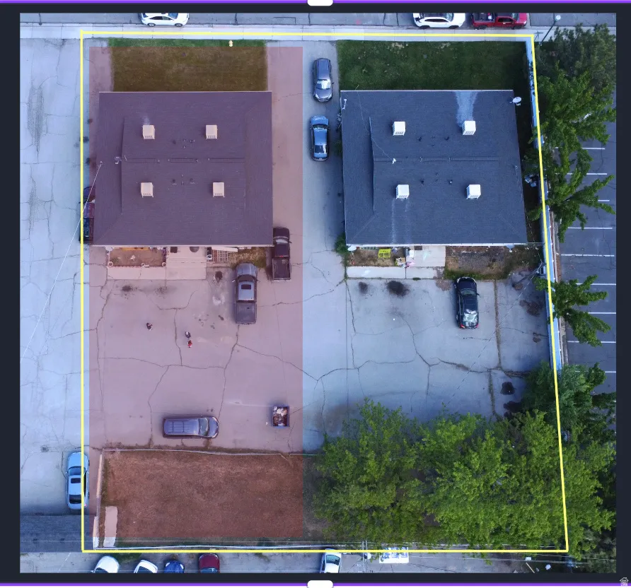 Aerial view of property and surrounding area with property parcel outlined