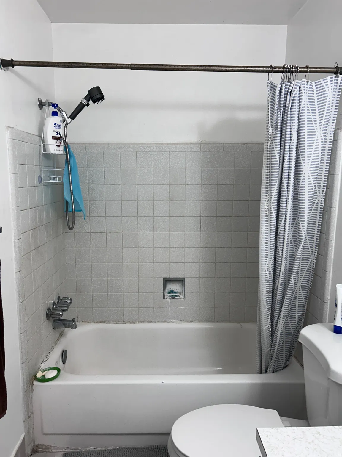 Bathroom with shower / tub combo with curtain and vanity