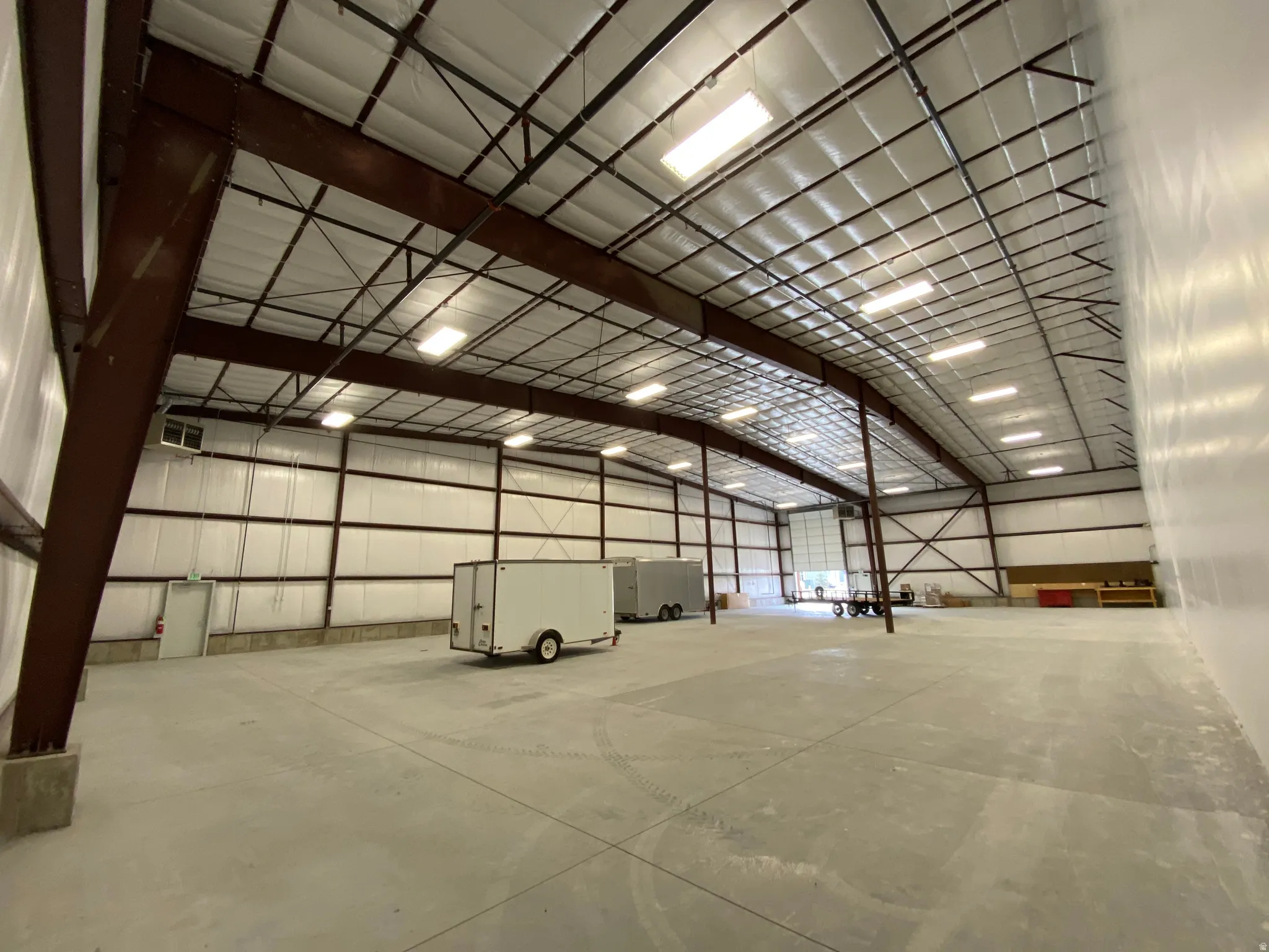 Garage featuring metal wall