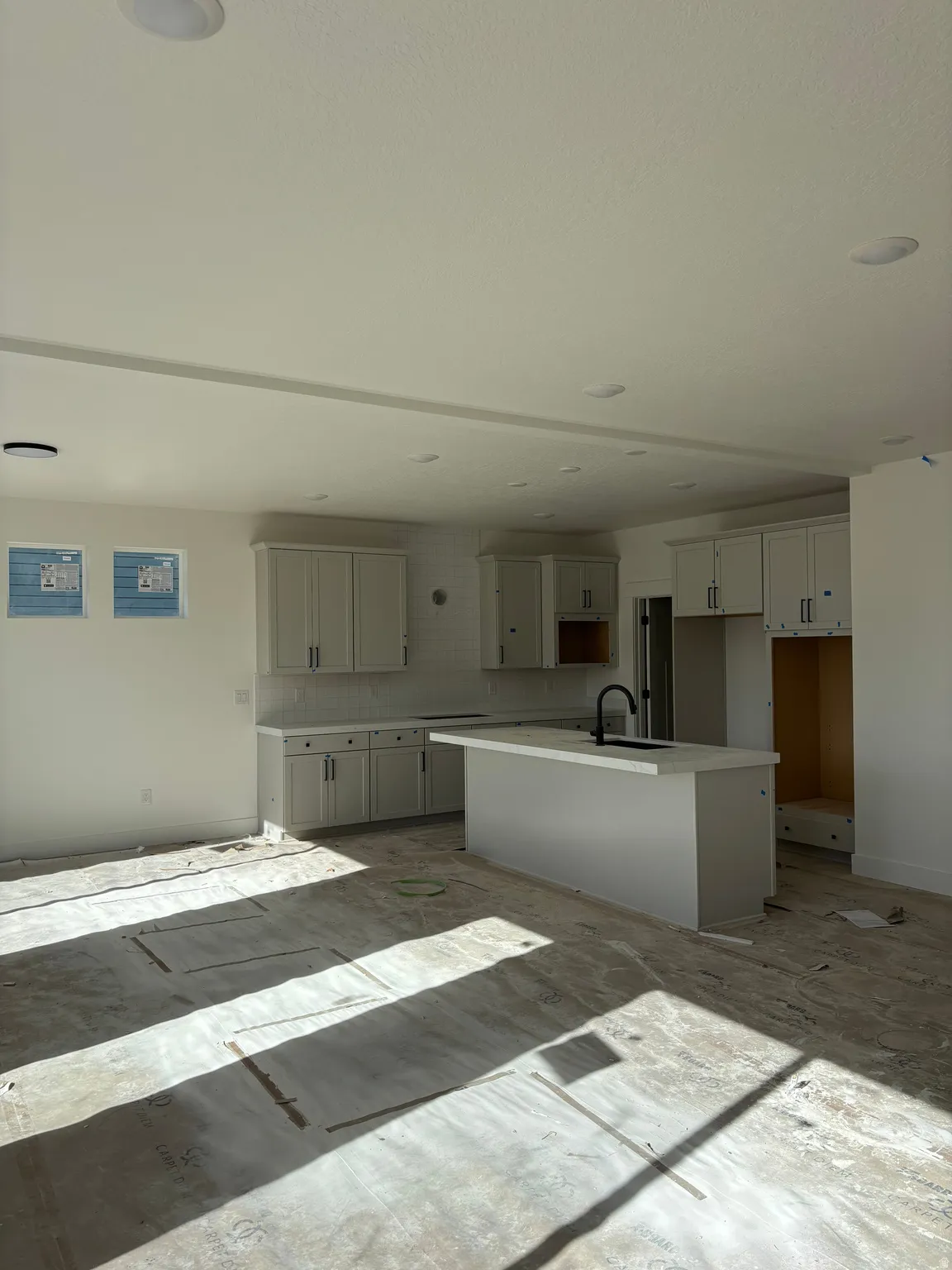 Kitchen featuring a center island with sink and a kitchen bar