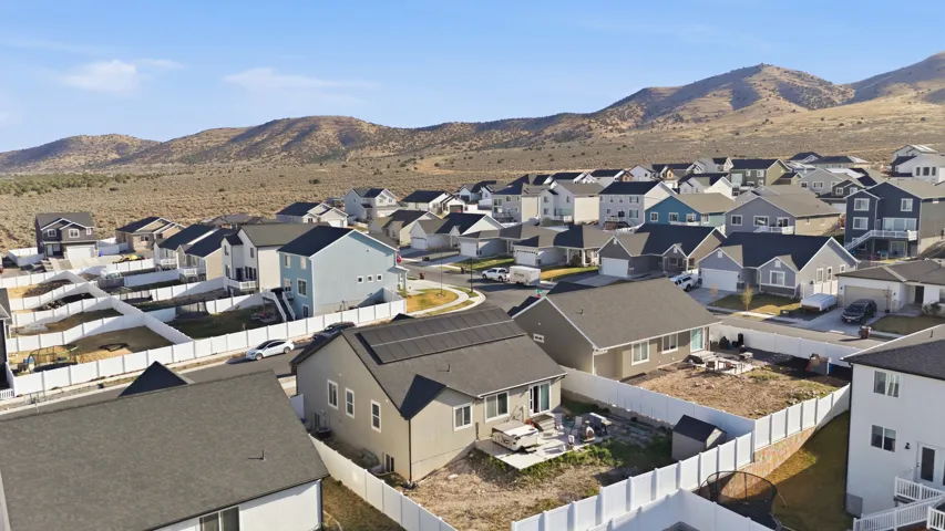 View of mountain backdrop featuring nearby suburban area