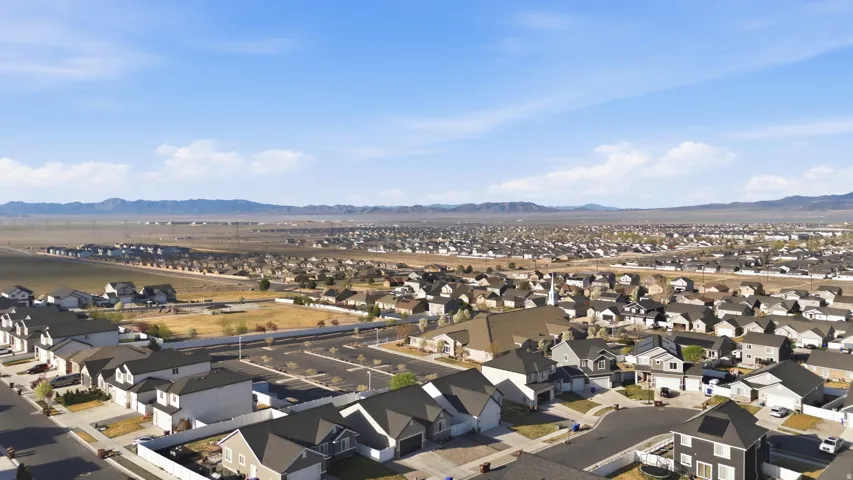 Aerial perspective of suburban area with a mountainous background