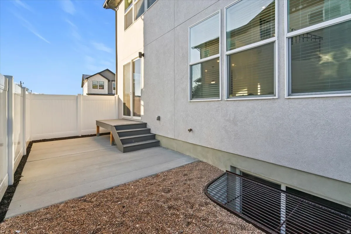 Fenced backyard with a patio area