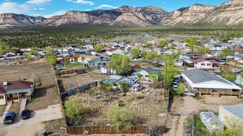 Aerial perspective of suburban area with a mountainous background