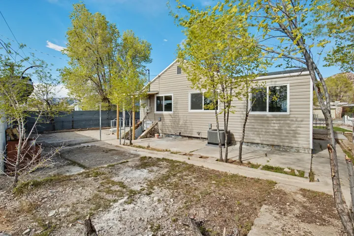 Rear view of property featuring a patio area