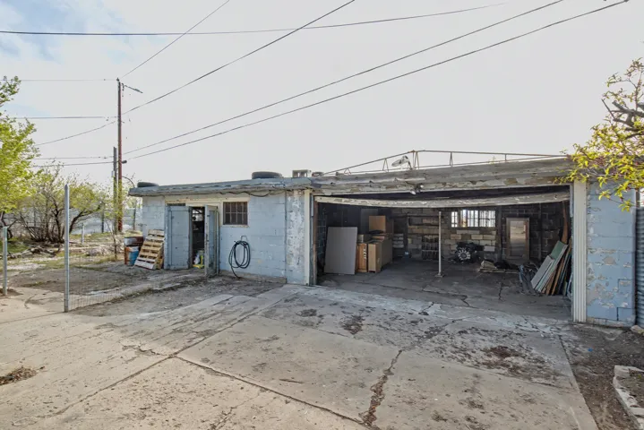 Garage featuring concrete driveway