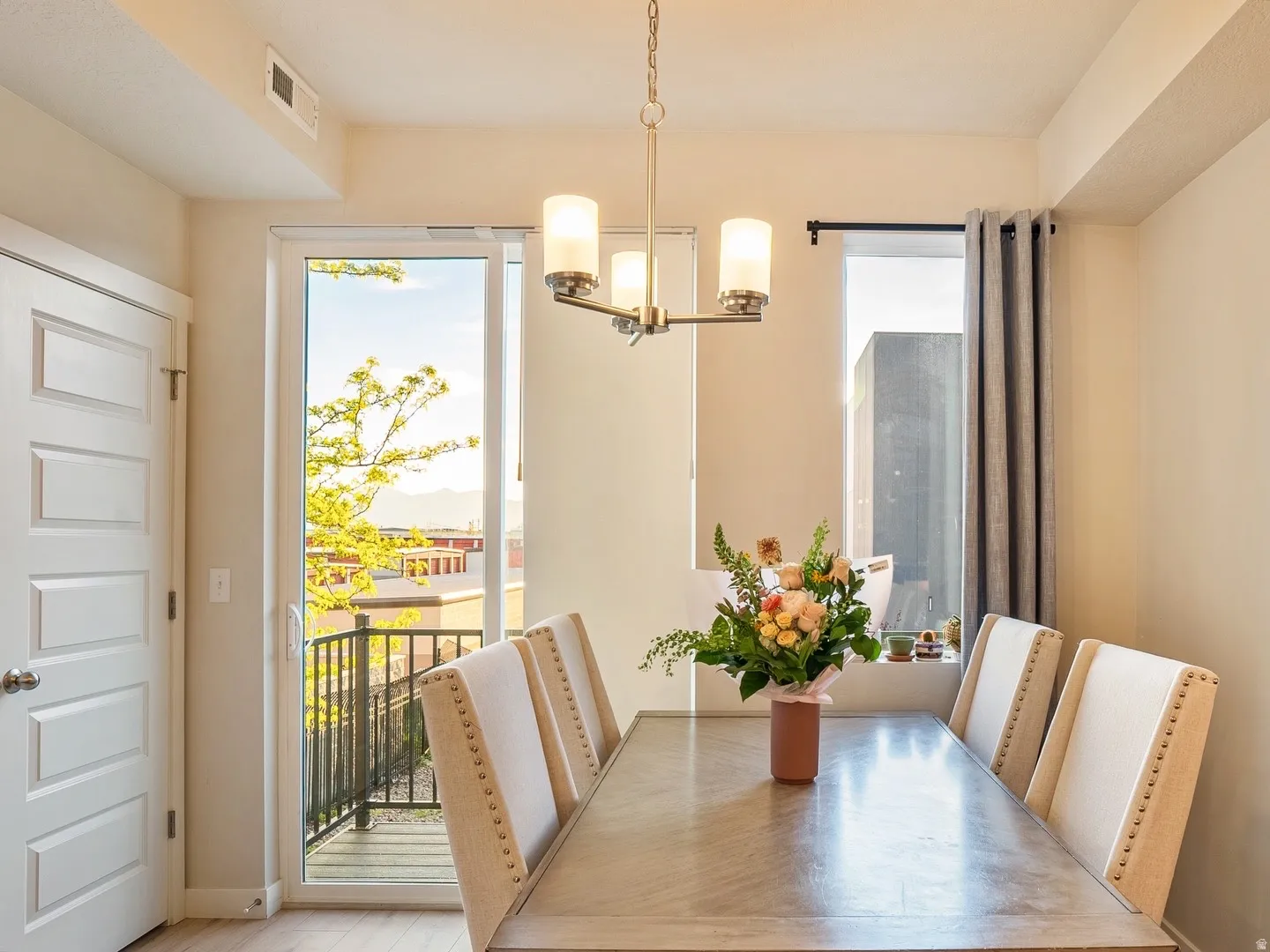 Dining area featuring baseboards and hanging lights