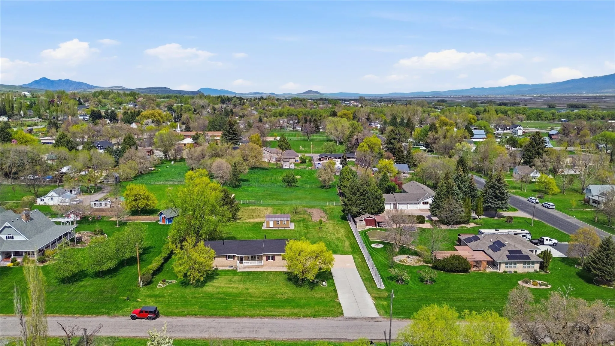 Aerial view of residential area featuring a mountainous background