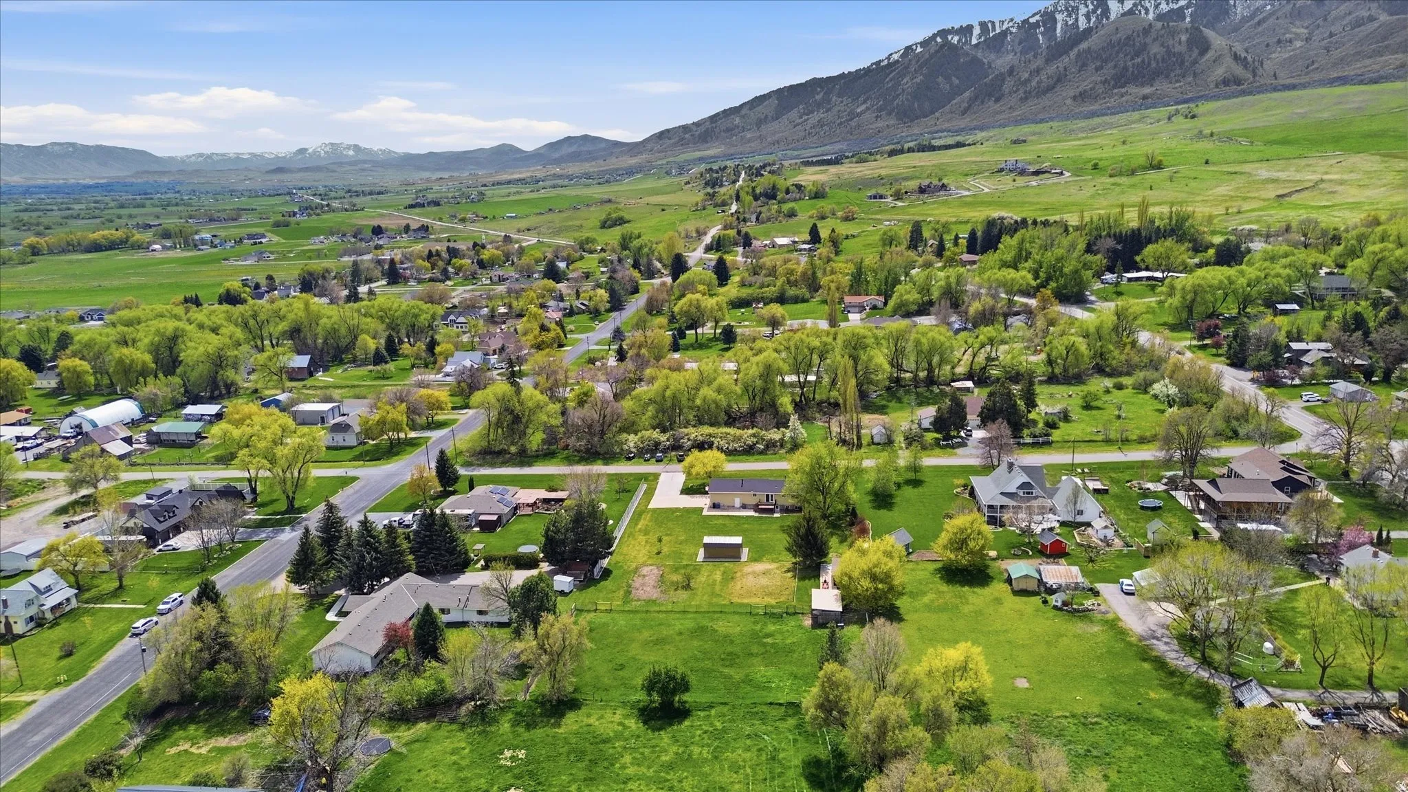 Aerial view of residential area with a mountainous background