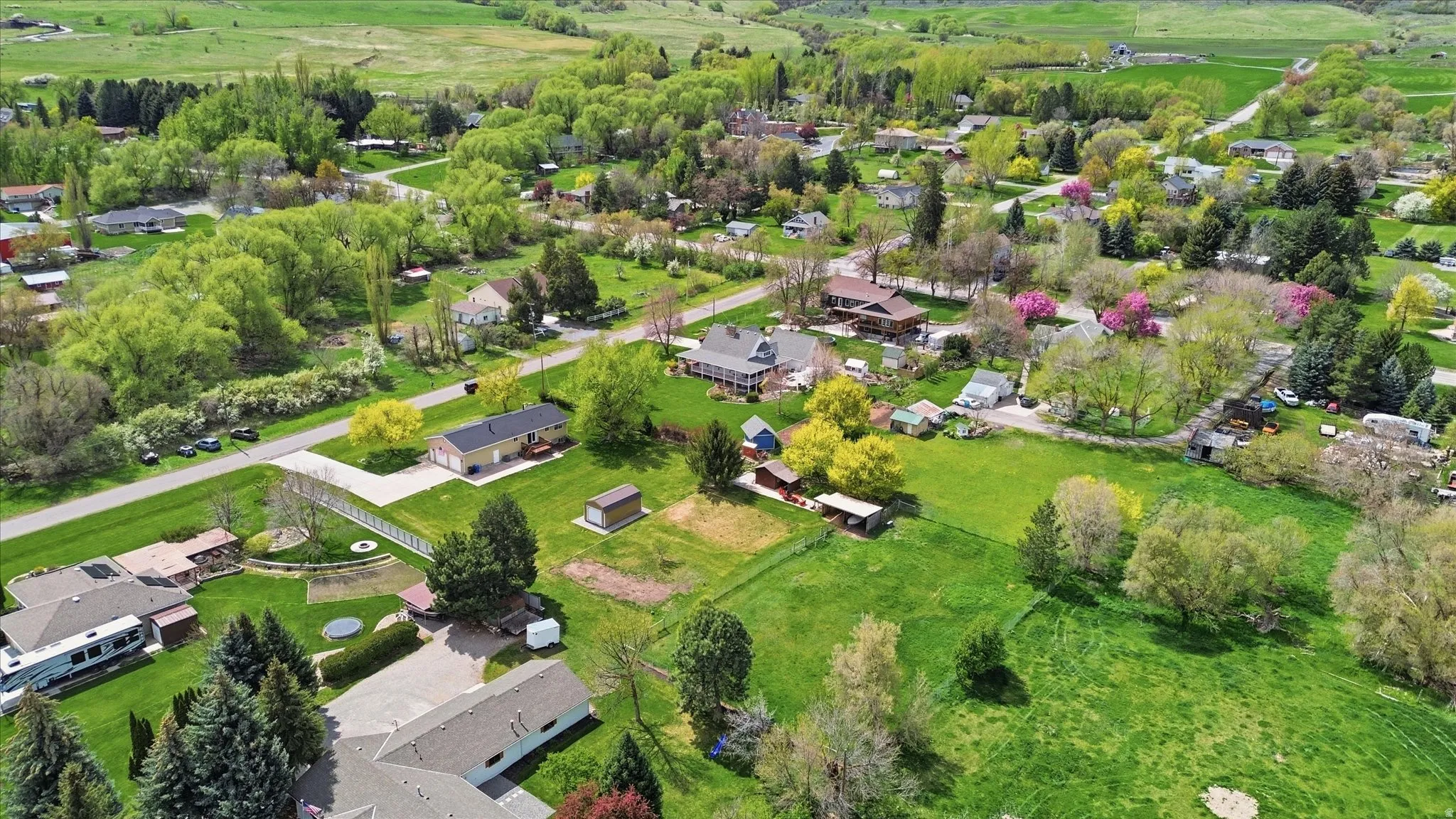 Aerial view of property's location with nearby suburban area