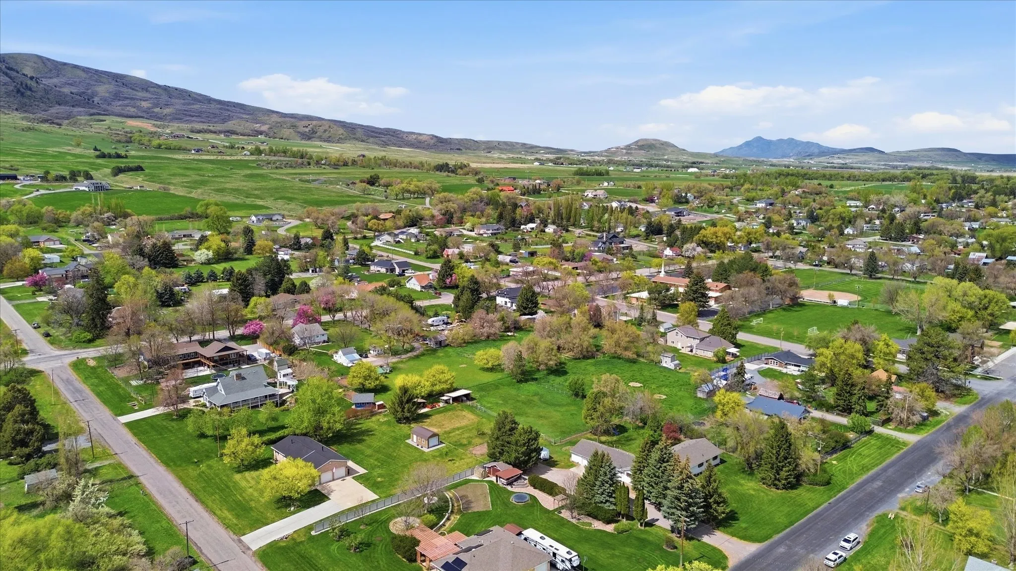 Aerial view of residential area with a mountain backdrop
