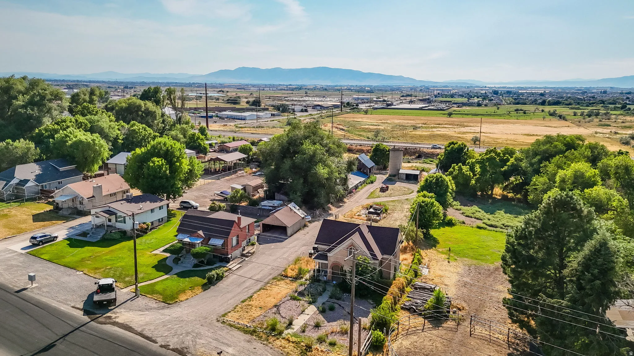 Aerial perspective of suburban area featuring a mountainous background