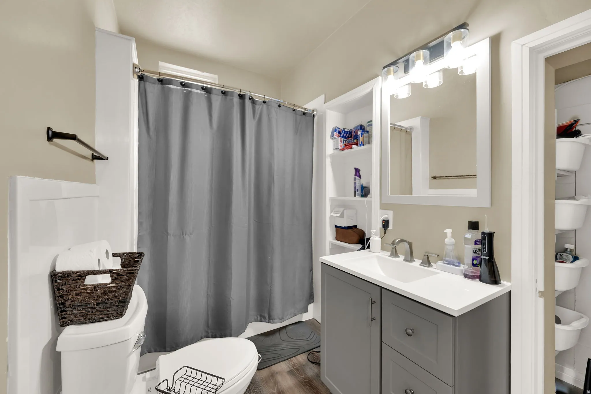 Bathroom with vanity and dark wood-type flooring