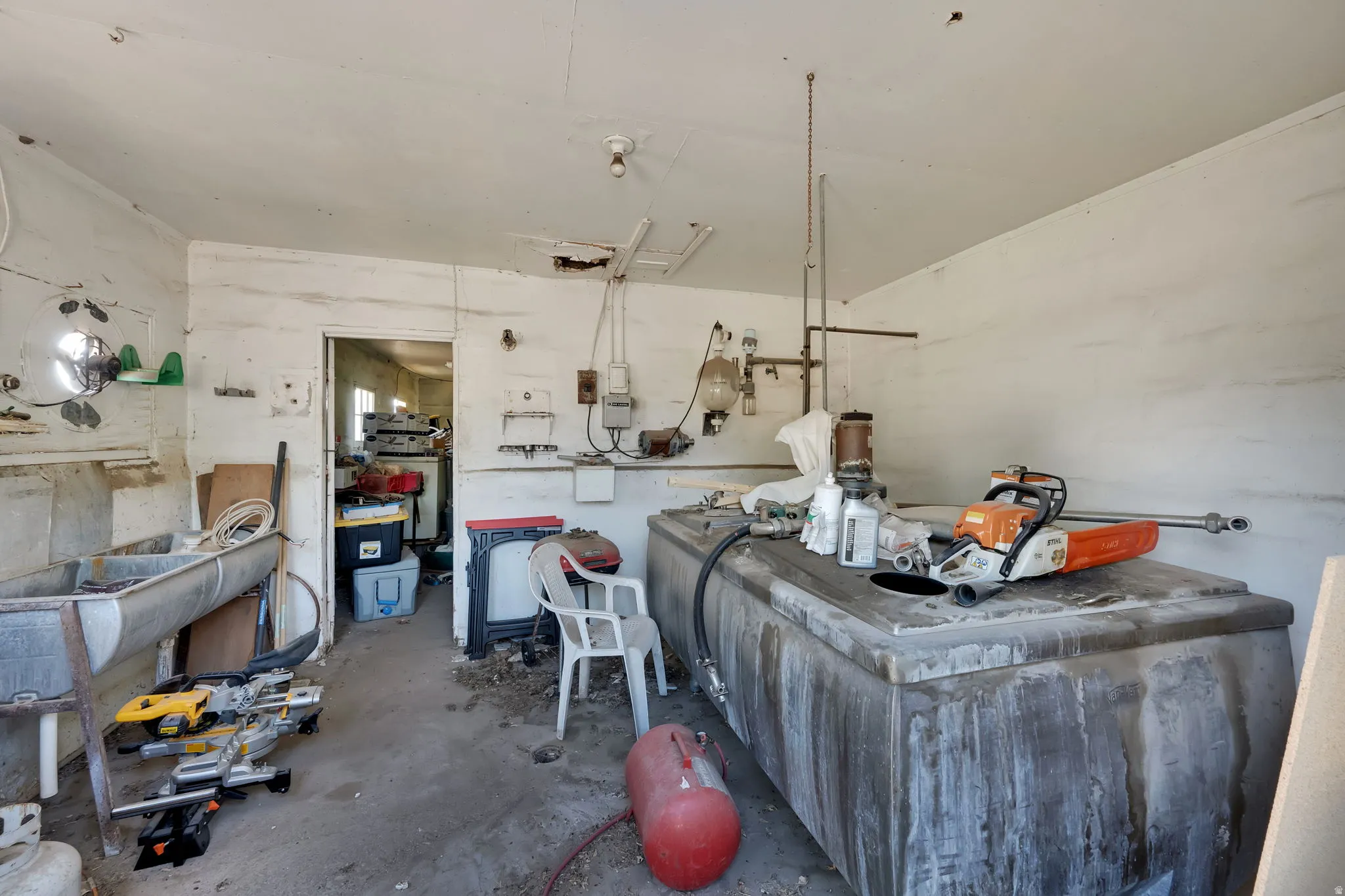 Miscellaneous room with unfinished concrete flooring