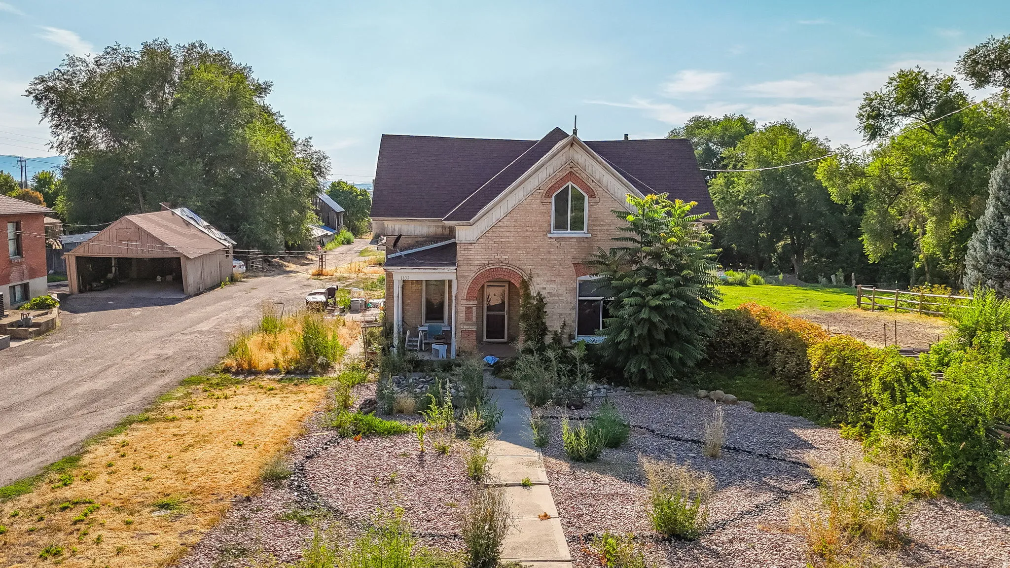 View of front facade featuring brick siding