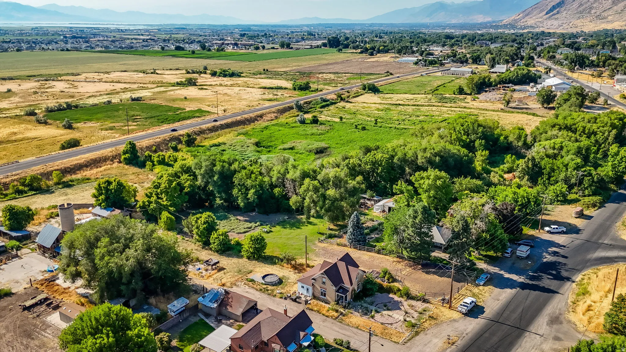 Aerial view of sparsely populated area with a mountainous background
