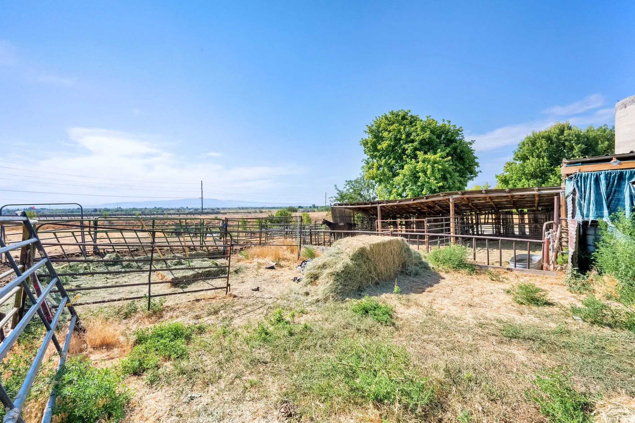 View of yard with an exterior structure, an outdoor structure, and a view of countryside